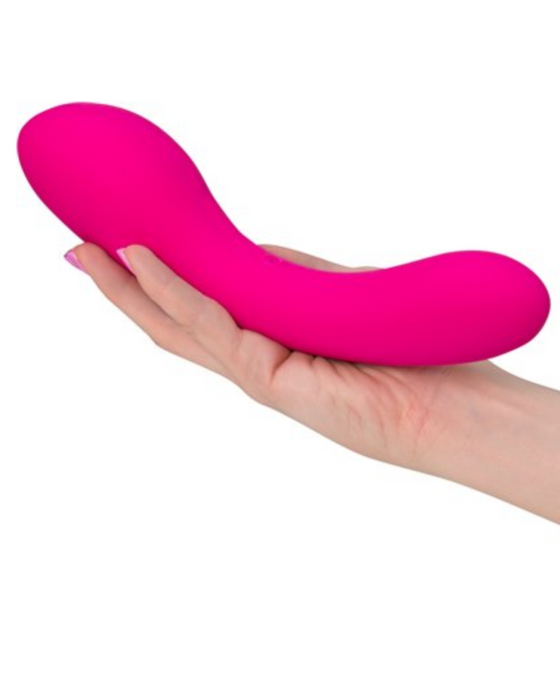 Swan Wand Powerful Double Ended Vibrator - Pink held in a person's hand to show the size