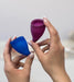 Fun Factory Fun Cup Size B Silicone Menstrual Cups being held in a woman's hands