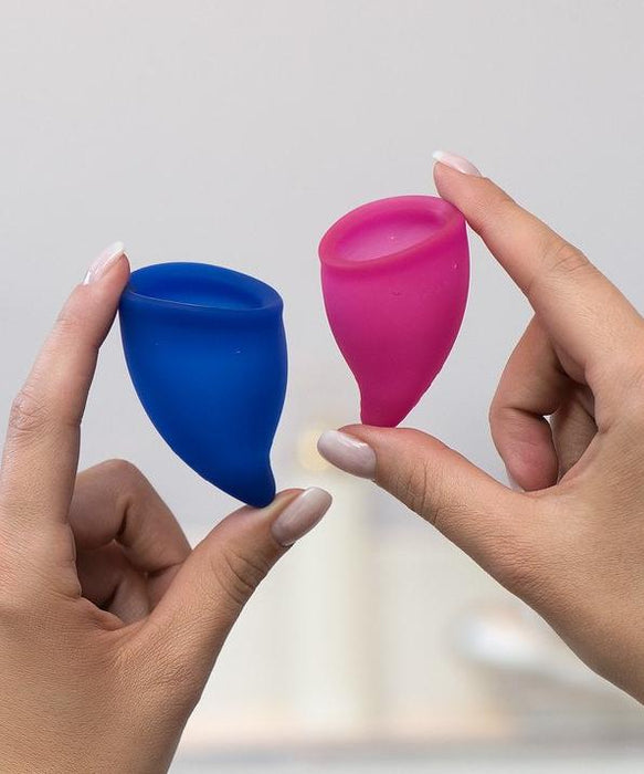Fun Factory Fun Cup Explore Kit Silicone Menstrual Cups HELD IN A WOMAN'S HANDS 