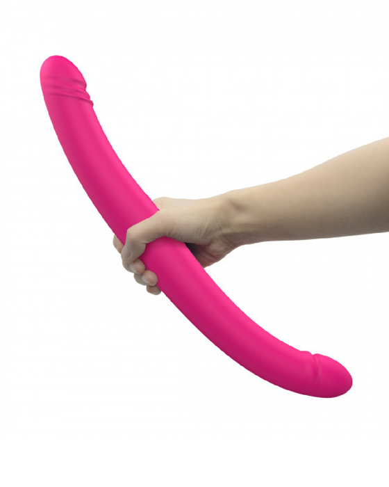 Orgasmic Double Duo 16.5 Inch Vibrating, Thrusting Pink Dildo held in hand