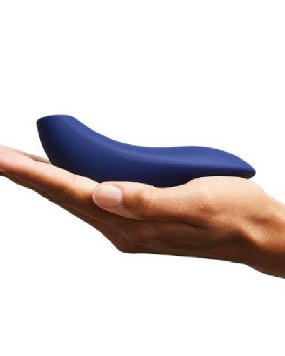 We-Vibe Melt Rechargeable Pleasure Air Clitoral Stimulator - Blue cradled in a palm