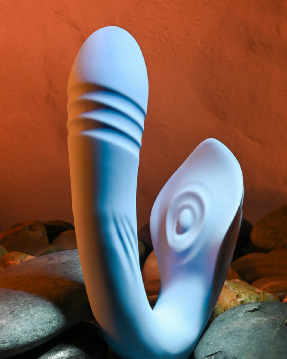Tap and Thrust Dual Stimulation Thrusting Vibrator side view on rocky background 