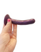 Please Slim Anal Silicone 5 Inch Dildo held in a hand