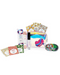 Exsens Escape Pleasure Kit contents showing flavoured massage oil, gloss, lube, condoms next to travel pouch 