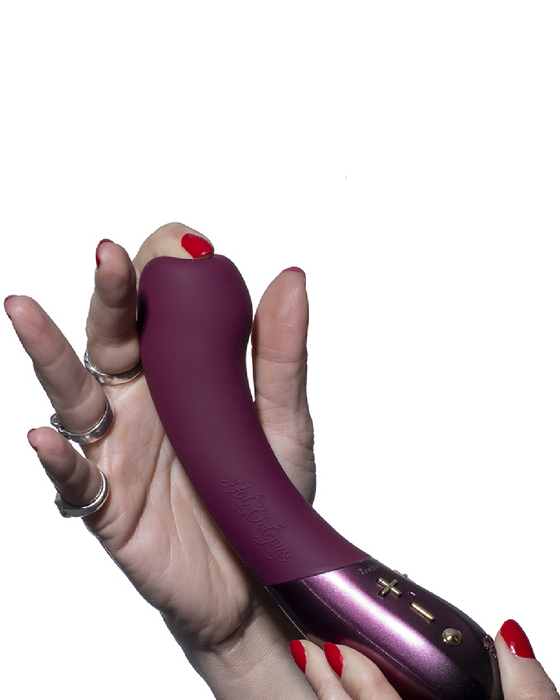 Kurve Dual Motor G- Spot Vibrator by Hot Otopuss  in hand pressing on the top 
