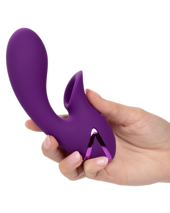 Huntington Beach Rabbit Vibrator with Clitoral Suction in hand 