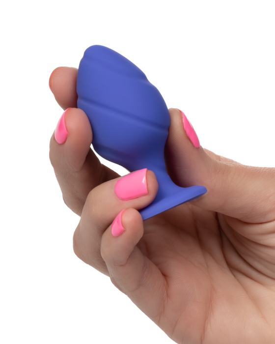 Cheeky Probe: 2 Graduated Textured Silicone Anal Plugs - Blue showing the smaller plug held in a woman's hand