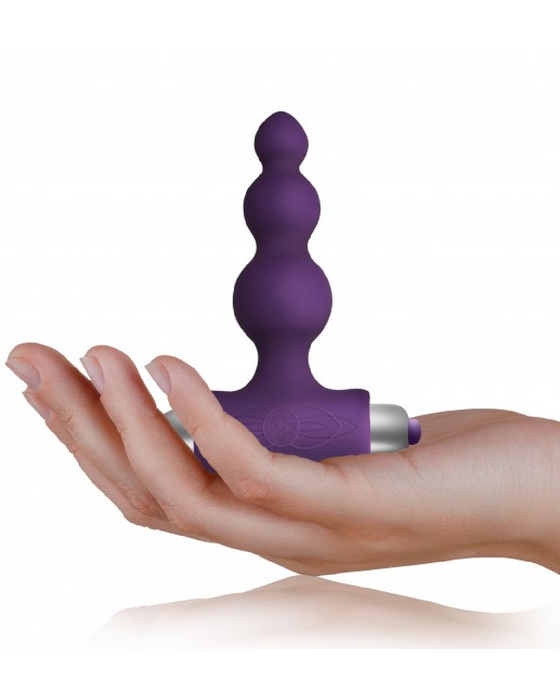 Petite Sensations Bubbles Butt Plug - Purple held in a hand