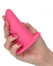 A hand with pink nail polish holding a She-ology™ Advanced 3-piece Wearable Vaginal Dilator Set from CalExotics.