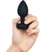 B-vibe Vibrating Jewel Anal Plug M/L - Black  model holding it in hand 