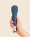 Deia Textured Silicone Wand Vibrator in model's hand 
