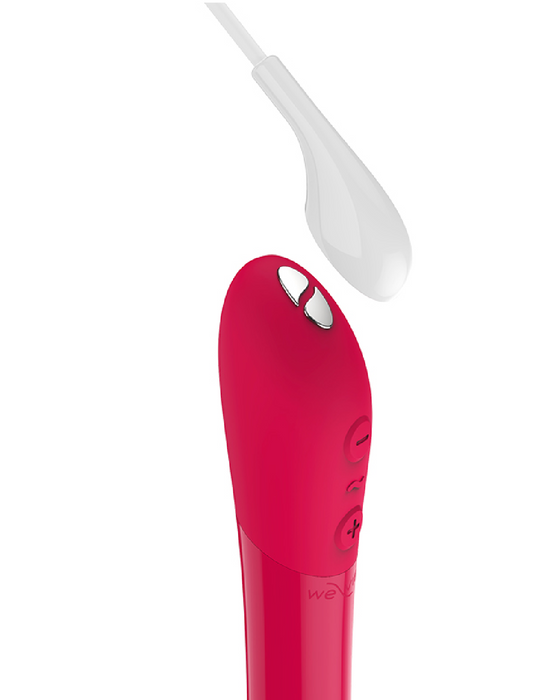 We-Vibe Tango X Powerful Bullet Vibrator - Cherry Red showing the magnetic charger cord and pads