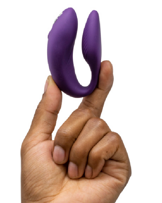 We-Vibe Chorus Remote & App Controlled Couples' Vibrator - Purple held in a hand
