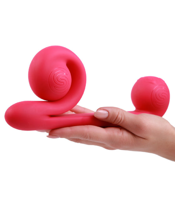 The Snail Silicone Waterproof Dual Stimulating Vibrator held in a hand