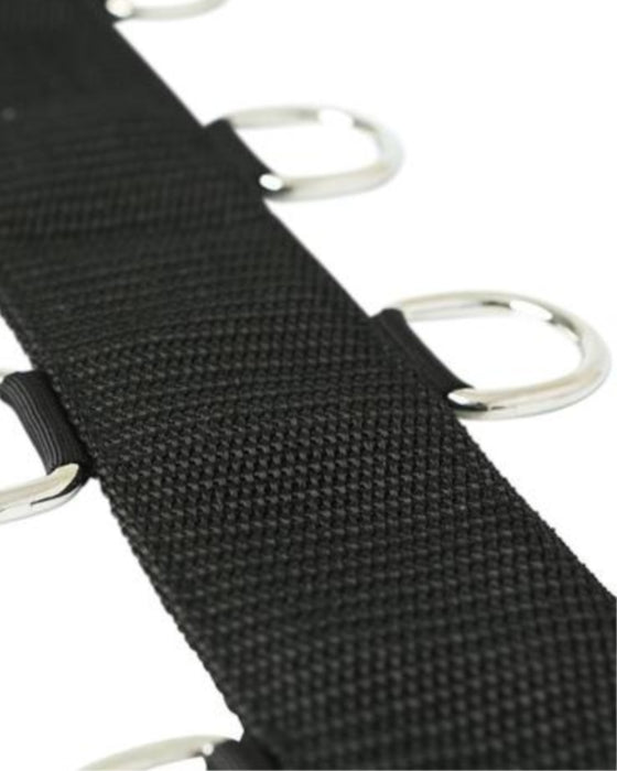 Close-up of a black Sportsheets neoprene neck collar with metal d-rings at intervals.