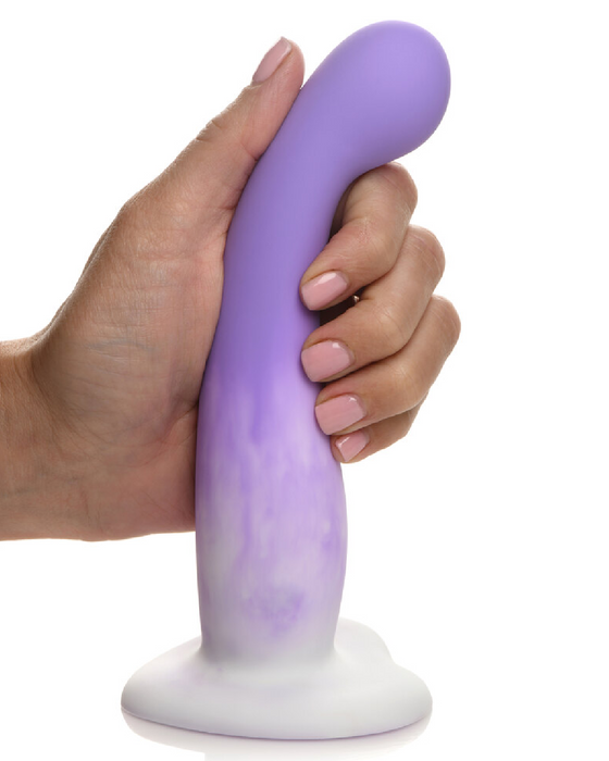 Hand holding Simply Sweet 7 Inch Slim G-Spot Dildo with Heart Base