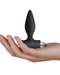Petite Sensations Tapered Smooth Vibrating Plug - Black in hand