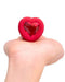 B-vibe Vibrating Heart Shaped Jewel Anal Plug M/L - Red showing gem bottom in model's hand 