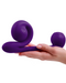 The Snail Silicone Waterproof Dual Stimulating Vibrator - Purple held in a hand
