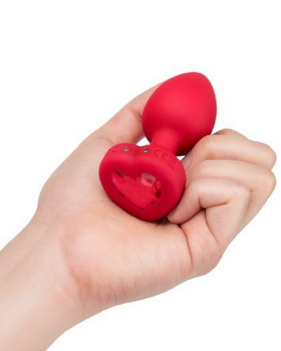 B-vibe Vibrating Heart Shaped Jewel Anal Plug M/L - Red in hand 