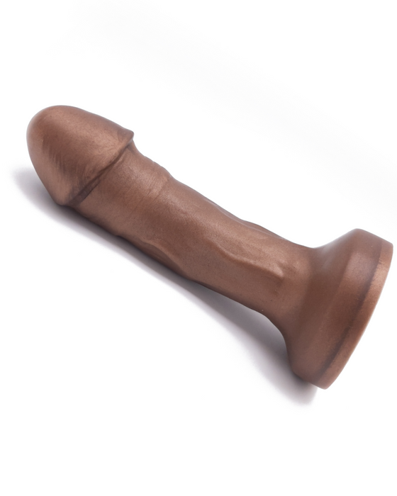 The Primo Chocolate Tone Uncut Dual Density Silicone Dildo by Uberrime side view horizontal