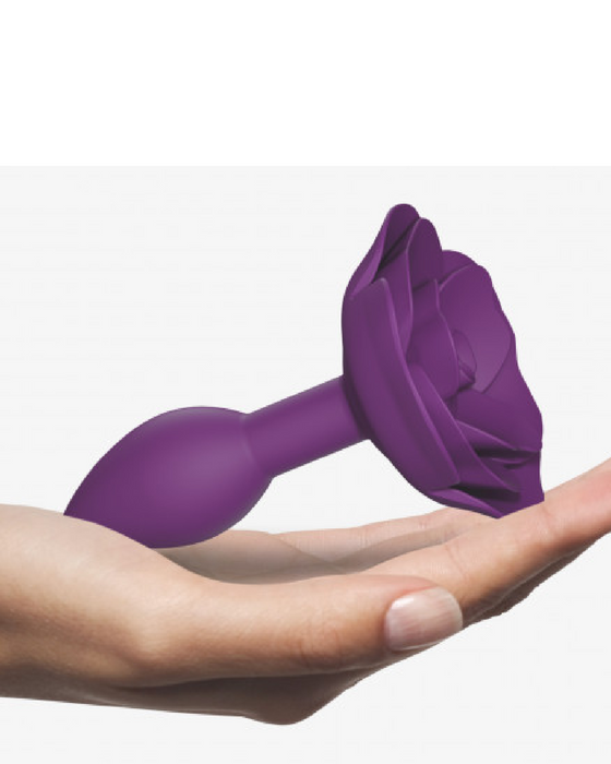 Open Roses Small Silicone Anal Plug - Purple in model's hand 