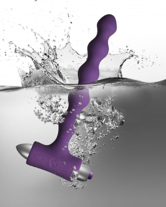 Petite Sensations Pearls String Vibrating Anal Beads - Purple submerged in water
