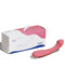 Dame Arc Silicone Waterproof G-Spot Vibrator beside its box on a white background