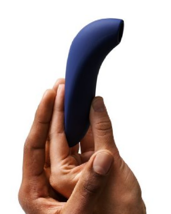 We-Vibe Melt Rechargeable Pleasure Air Clitoral Stimulator - Blue held by 2 hands - one dark skin, one light