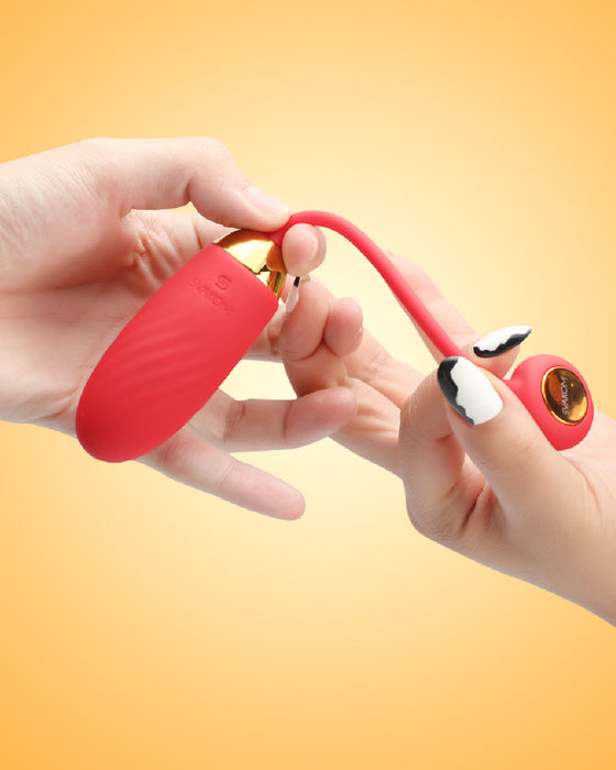 Ella Neo Interactive App Controlled Wearable Egg Vibrator held in hand on yellow background