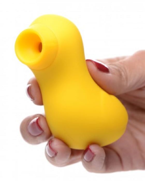 Sucky Ducky Silicone Clitoral Sucker - Yellow held in a woman's hand