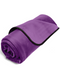 A rolled-up purple Liberator Fascinator Throw Mini Sized Velvety Sex Blanket with a black trim, isolated on a white background.