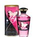 An image of a cylindrical package alongside a bottle of Shunga Aphrodisiac Warming Raspberry Erotic Oil 3 oz, both adorned with a sensual artistic depiction and labeled with product information about being flavored lubricant and latex friendly.