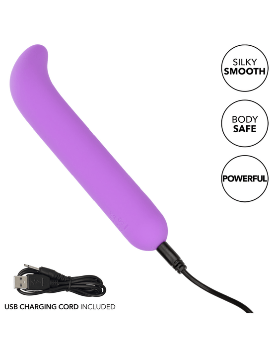 CalExotics Vibrator Bliss Mini G-Spot Vibrator on angle with charging cord plugged in 