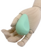 A wooden mannequin hand gently cradling a mint green, triangular-shaped Ritual Chi Palm Sized Ergonomic Soft Silicone Bullet Vibrator by Doc Johnson.