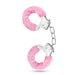 A pair of pink Blush Temptasia Furry Cuffs Handcuffs isolated on a white background.