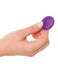 hand holding the remote control for 3Some Total Ecstasy Silicone Remote Controlled Double Penetration Vibrator - Purple